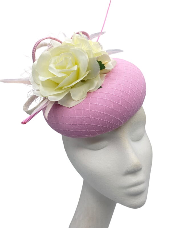 Stunning pink headpiece with ivory flower detail.